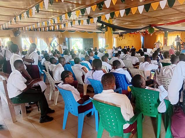 Participants in a hall during a youth gathering